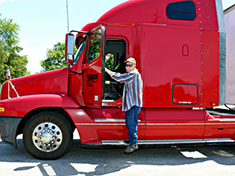 Semi Driver Getting in Red Semi Truck for Delivery or Pick up